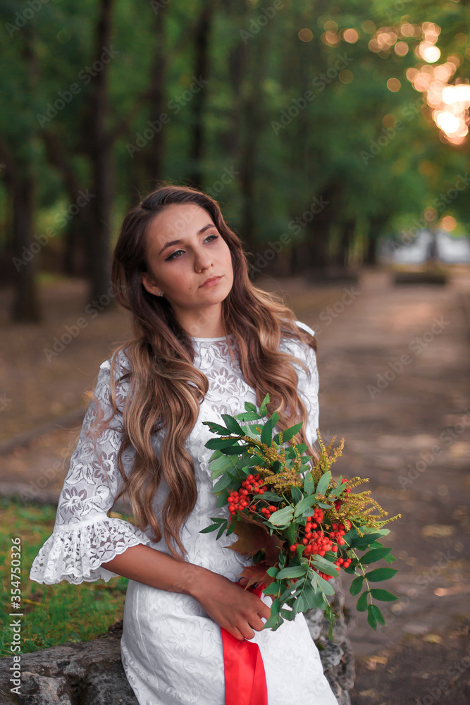 Bright unusual elegant autumn bouquet in hands of the bride
