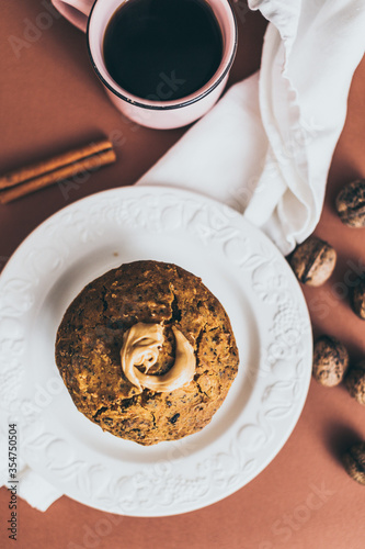 cup of black coffee and cake muffin cinnamon walnuts on a plate  glutenfree vegan sugarfree peanut butter