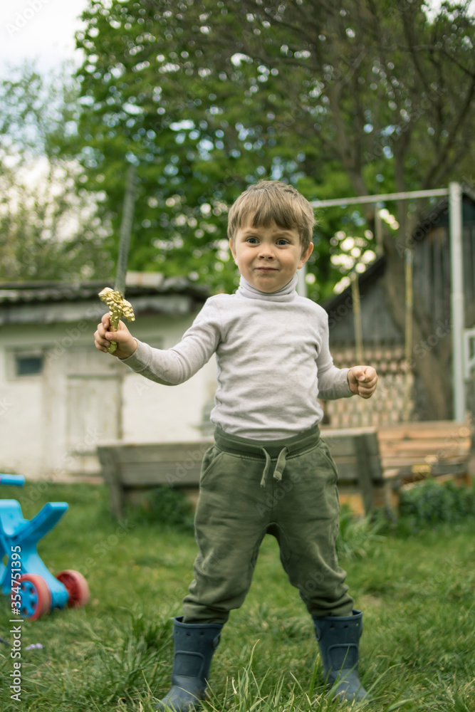 Cute little boy with a sword in his hands plays in nature
Cute little boy with a sword in his hands plays in nature