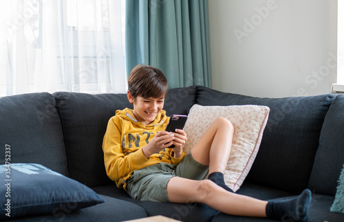 Kid addicted to mobile phone, smartphone 