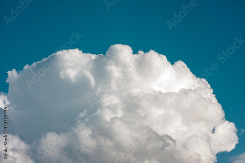 large textured cloud against the blue sky