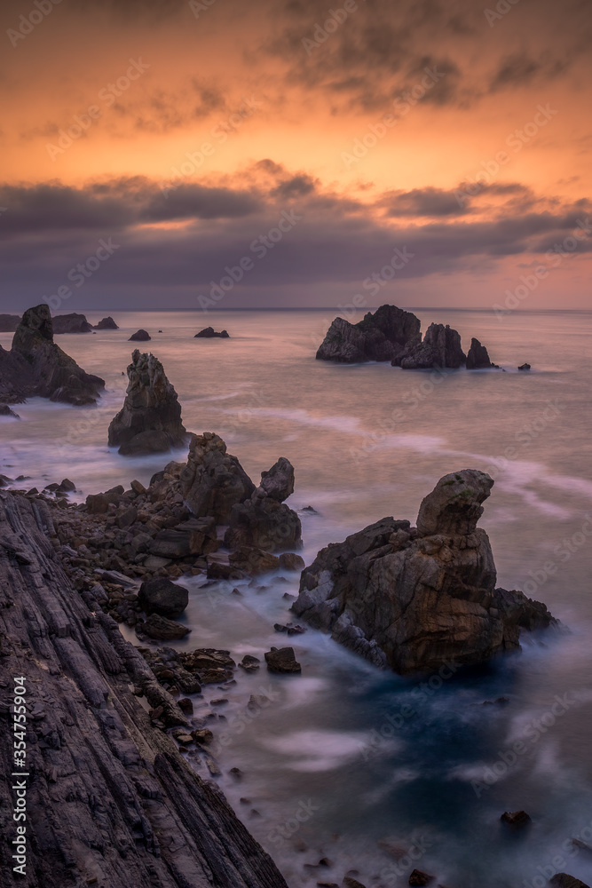 Vertical shot of Costa Quebrada at sunset in Liencres, Cantabria, Spain