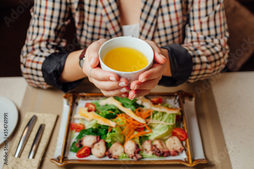 girl holding soup