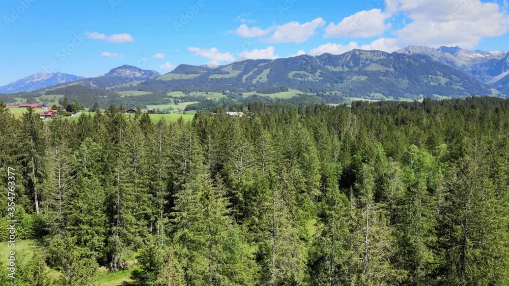 Flying over fir trees in Bavaria - awesome landscape in the German alps. Aerial drone footage Flying over fir trees in Bavaria - awesome landscape in the German alps. Aerial drone footage