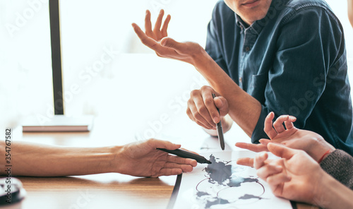 Obraz na płótnie close up. a group of employees discussing the distribution infrastructure. Elements of this image furnished by NASA w salonie