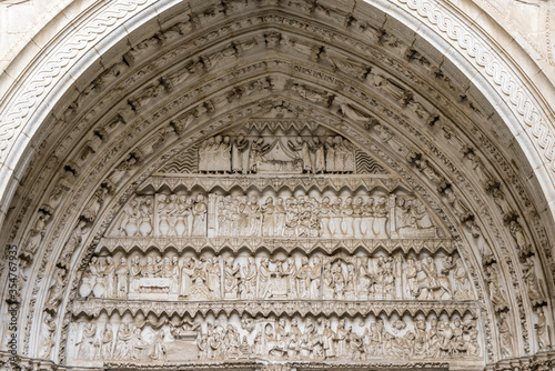 Exterior view of Toledo Cathedral (Catedral de Toledo), north entrance tympanum detail with Carved scenes of Jesus life. photo