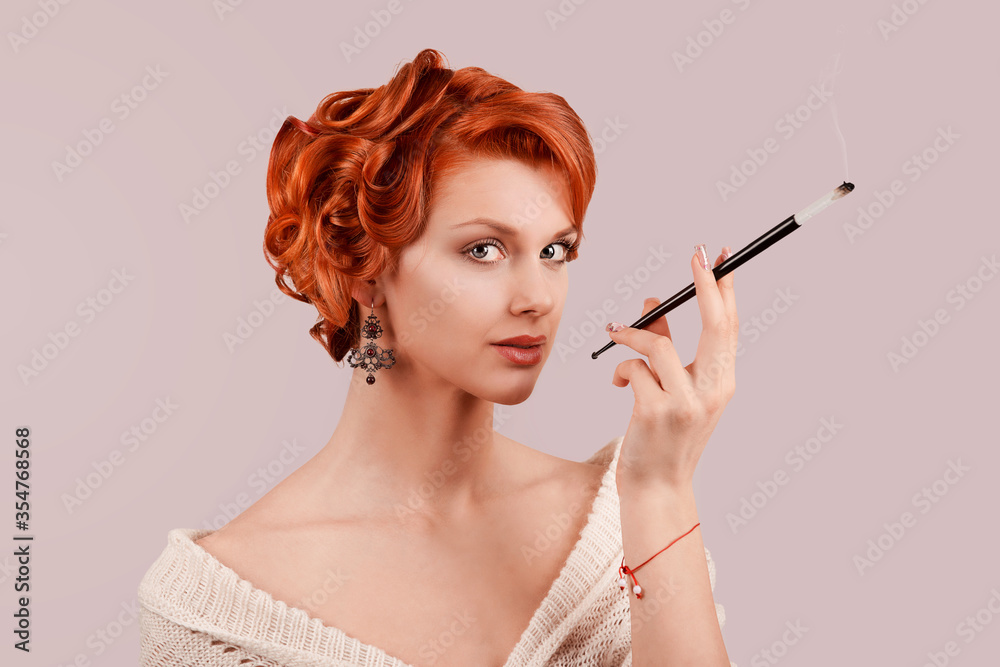 retro beauty girl up hairdo style posing in studio smoking a cigarette