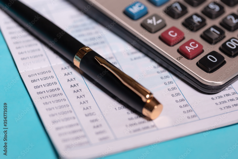 calculator and stationery items on the table for financial activity calculator and stationery items on the table for financial activity