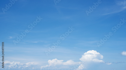 Nature view white clouds on clear blue sky background in summer and holiday, Shinny day with fine weather