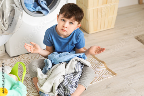 Sad little boy with dirty c...