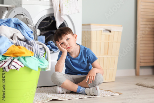 Sad little boy with dirty c...