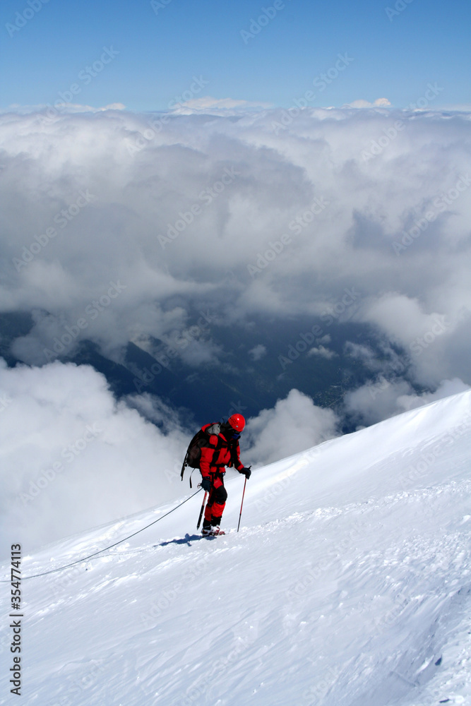 Mountaineer climbing Mont Blanc at Gouter Route in French Alps, France.