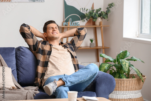 Lazy man spending day off a...