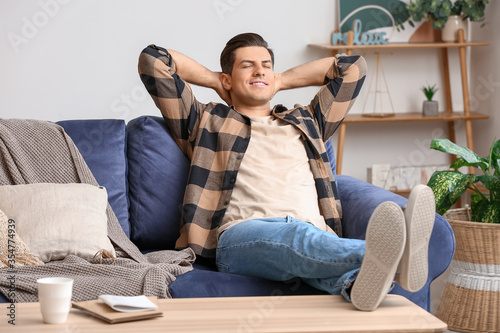 Картината върху платно Lazy man spending day off at home