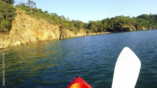 First person view Canoe riding across the shore over the sea on daylight at Gunluklu beach Fethiye Mugla Turkey photo