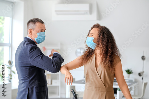Colleagues greeting each ot...