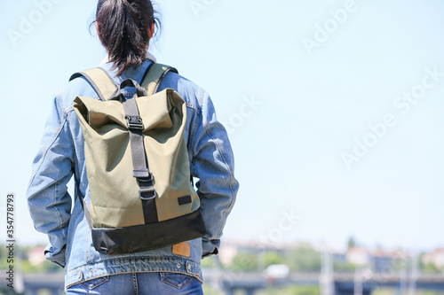 Female traveler with backpack outdoors © Pixel-Shot