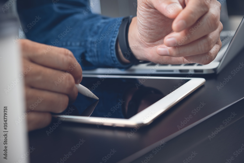 Business man graphic designer using stylus pen working on digital tablet computer - obrazy, fototapety, plakaty 