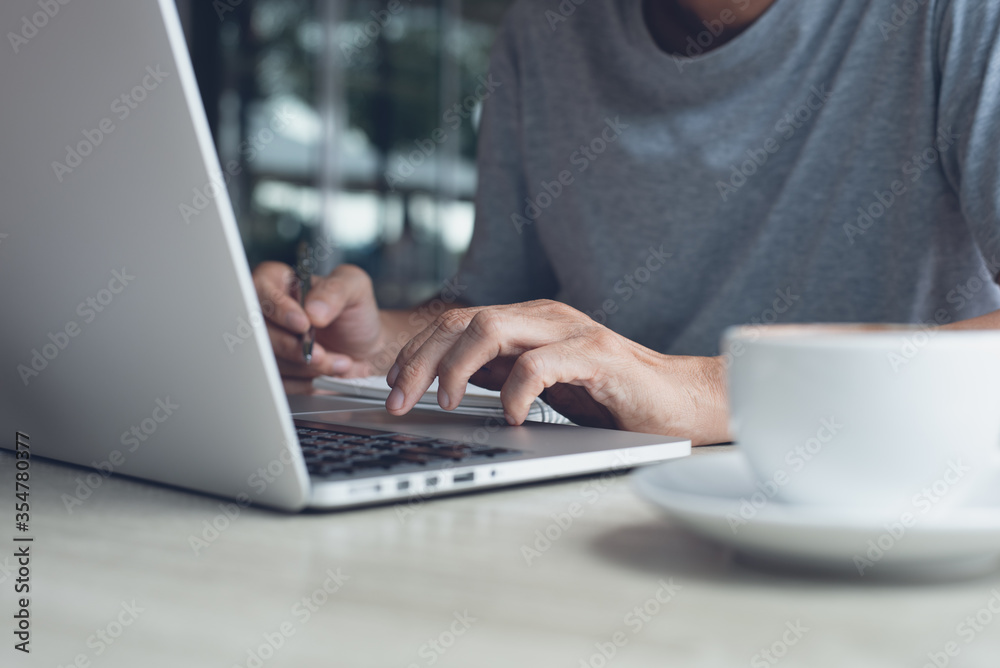 Fototapeta premium Student studying online via laptop computer or man working from home