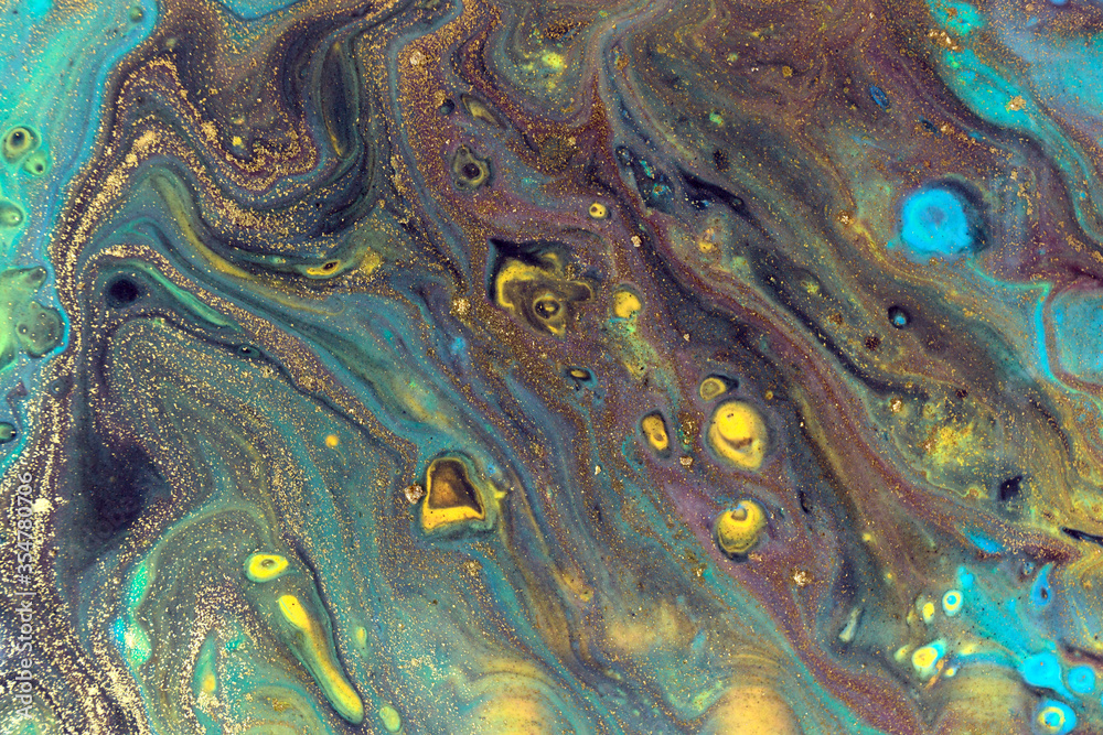 Dark liquid pattern with bright blue and gold cells.