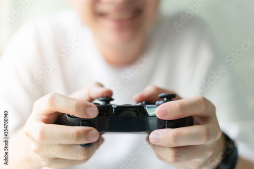 Young man hands holding joystick.Play the video game concept.
