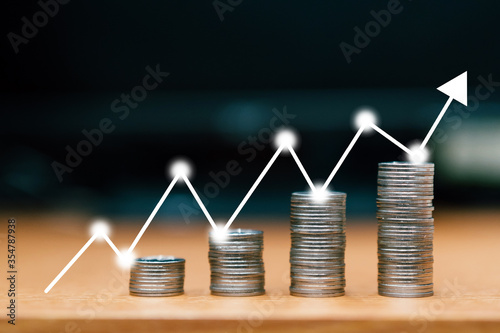 step of coins stacks with Stock market or forex trading graph, money, saving and investment or family planning concept.