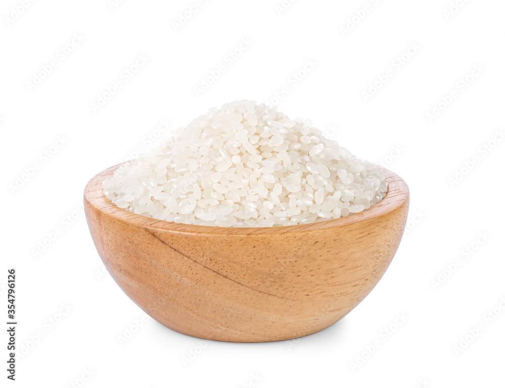 Rice in a wooden cup on a white background. Rice in a wooden cup on a white background.