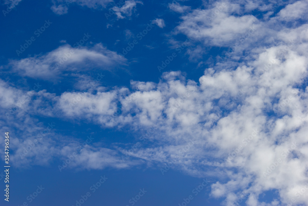 Fototapeta premium white cloud, contrails, vapour trails, jet streak on blue sky background