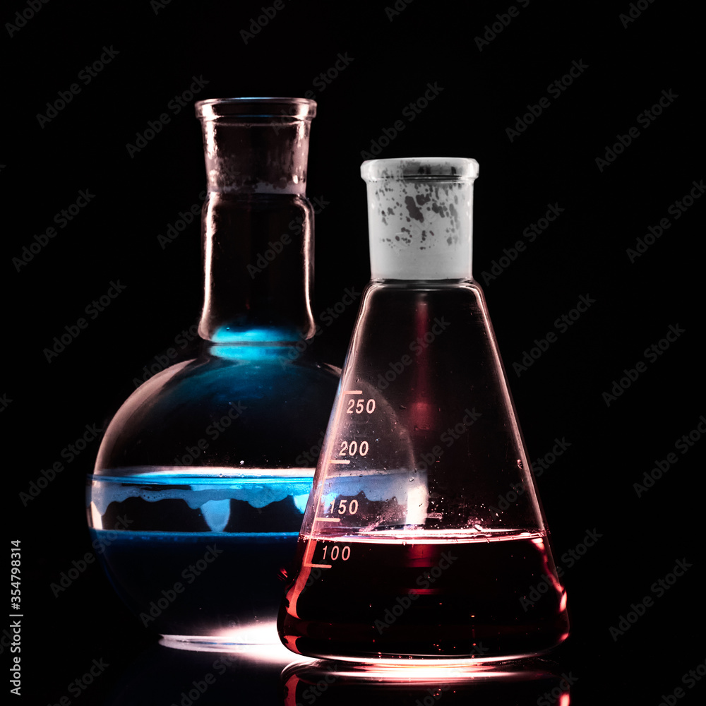 Glass flask with a chemical reagent. Glass flask with a chemical reagent.