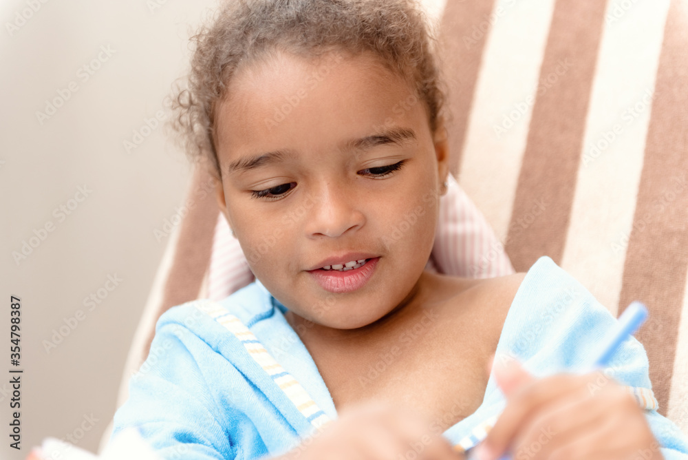 Little girl drawing at home sitting on chair. Little girl drawing at home sitting on chair.