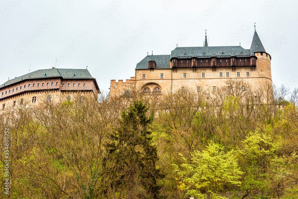 Karlstejn castle stands on a mountain.