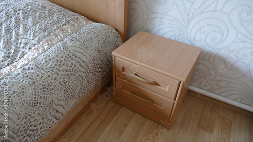 Фотография the nightstand is near the head of the bed