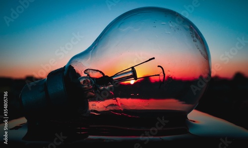 sunset captured in the bulb in beautiful colours background © clicky_guy