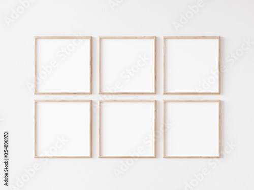 Fototapeta Naklejka Na Ścianę i Meble -  Six square thin wooden frame on white wall. 3d illustration.