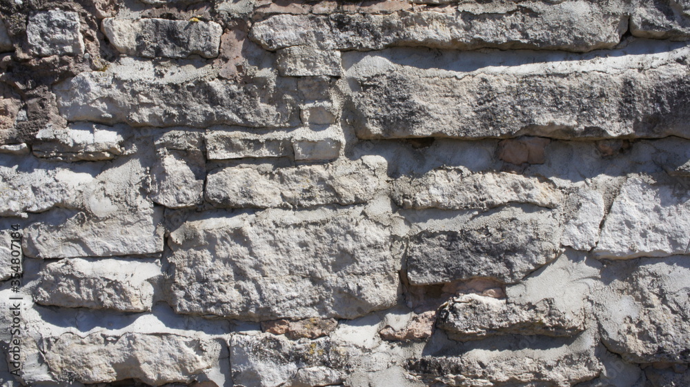 old stone wall masonry made of natural limestone stone beautiful textured background gray old stone wall masonry made of natural limestone stone beautiful textured background gray