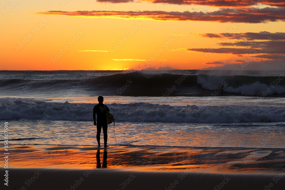 Silhoette Surfer on a misty beach in Chiba Japan with a stunning sunrise and waves. Lifestyle,surfboard,surfing,Japansurf