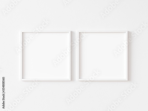 Two square white frame mock up on white wall. 3d illustration.