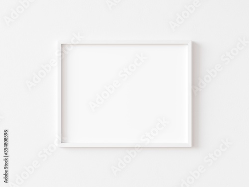 Horizontal white frame mockup on white wall. 3d illustration.