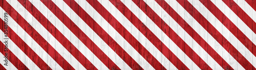 banner of wooden boarding painted red and white restricted area marking