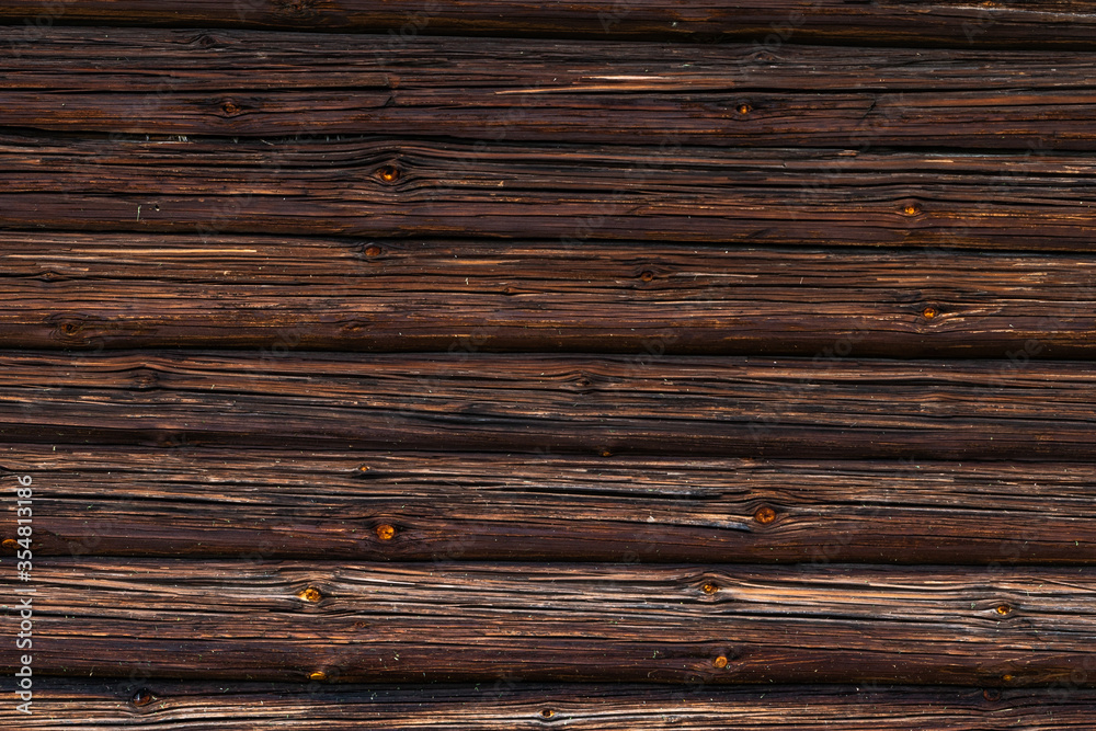 texture of the brown log wall of the house