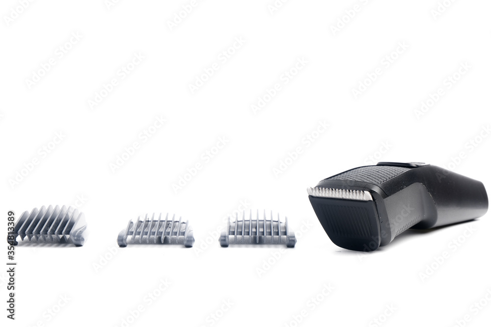Beard trimmer and 3 comb variance on isolated white background. Beard trimmer and hair shaver machine sales increase caused ban on hair salon and barbershop caused by covid-19 pandemic. Beard trimmer and 3 comb variance on isolated white background. Beard trimmer and hair shaver machine sales increase caused ban on hair salon and barbershop caused by covid-19 pandemic.