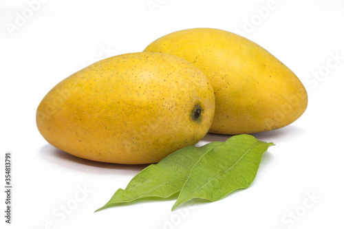 set of two fresh mango with mango leaves on white background