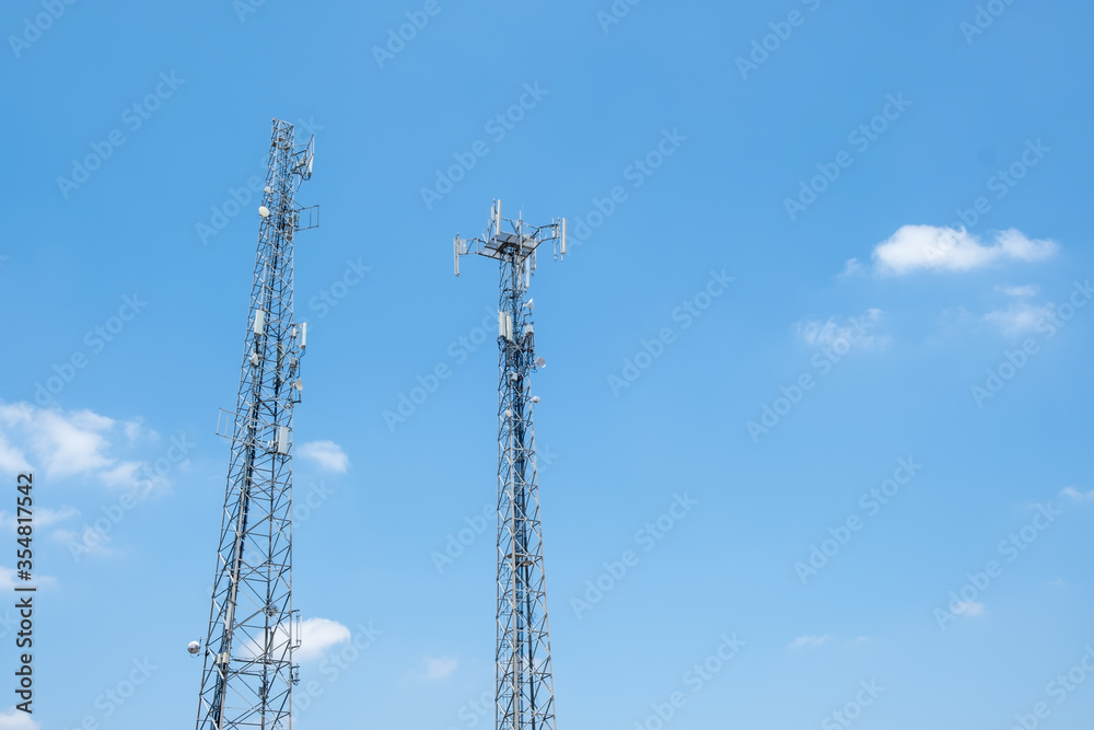 Cellular Base Station or Base Transceiver Station. Telecommunication tower. Wireless Communication Antenna Transmitter. 3G, 4G and 5G Cell Site with blue and cloudy sky. Cellular Base Station or Base Transceiver Station. Telecommunication tower. Wireless Communication Antenna Transmitter. 3G, 4G and 5G Cell Site with blue and cloudy sky.