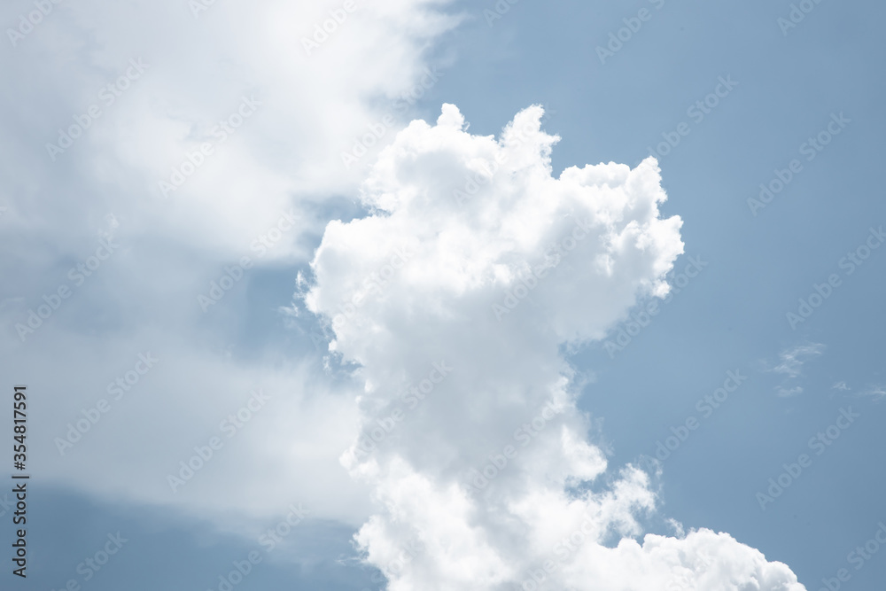 white fluffy clouds in the blue sky .blue sky background with tiny clouds white fluffy clouds in the blue sky .blue sky background with tiny clouds