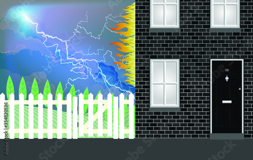 Lightning strike on residential house with building ablaze with flames coming from the premises