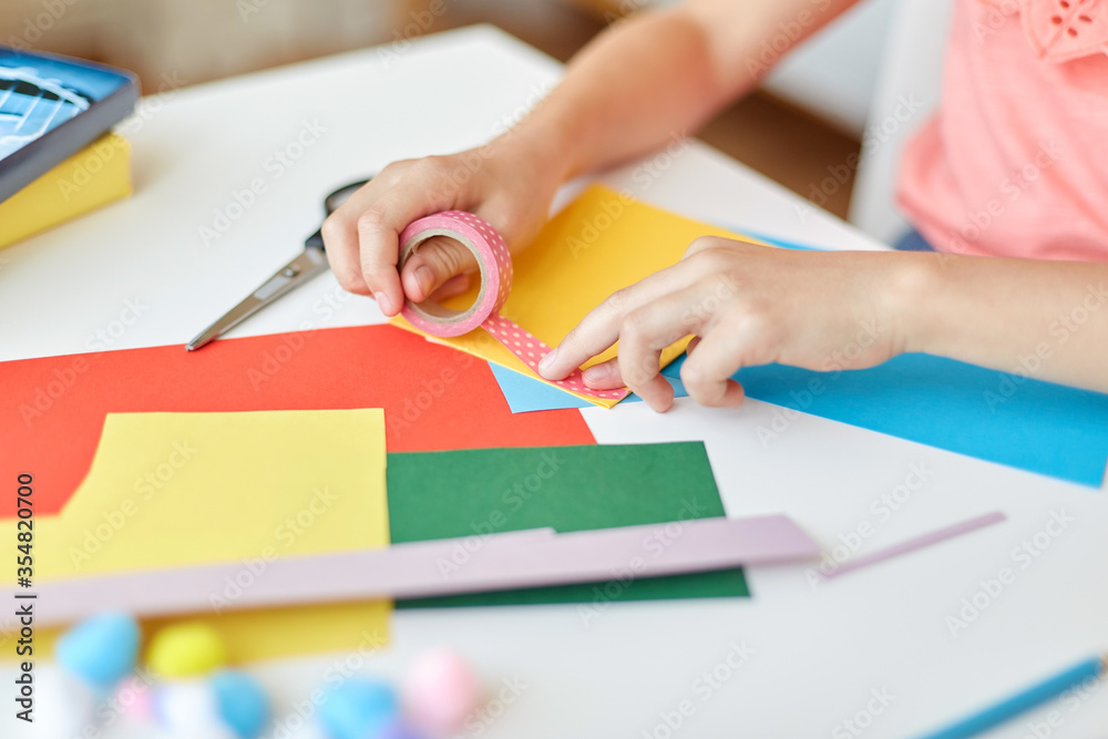 childhood, creativity and hobby concept - close up of creative girl with adhesive tape making greeting card at home childhood, creativity and hobby concept - close up of creative girl with adhesive tape making greeting card at home