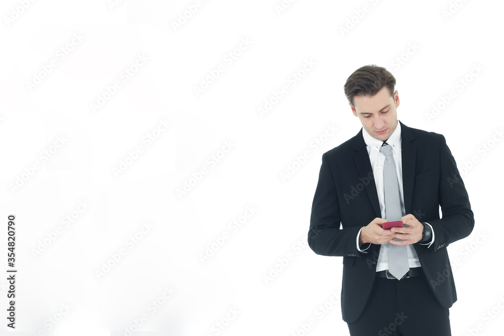 Handsome businessman in a suit hand holding smartphone isolated on white background.Copy Space Handsome businessman in a suit hand holding smartphone isolated on white background.Copy Space