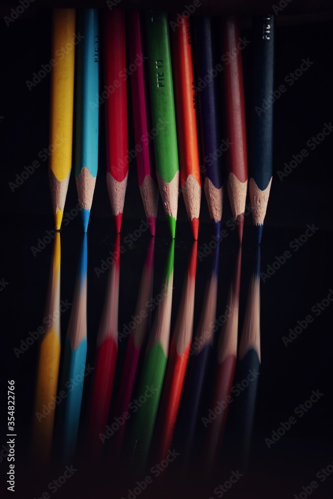 color pencils on black background color pencils on black background
