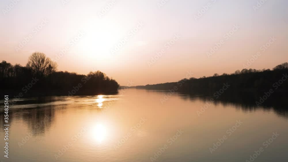 Cinematic slow fly Above the River at Sunset time. River Sava in Bosnia and Herzegovina has beautiful sunset and nature around river. Cinematic slow fly Above the River at Sunset time. River Sava in Bosnia and Herzegovina has beautiful sunset and nature around river.