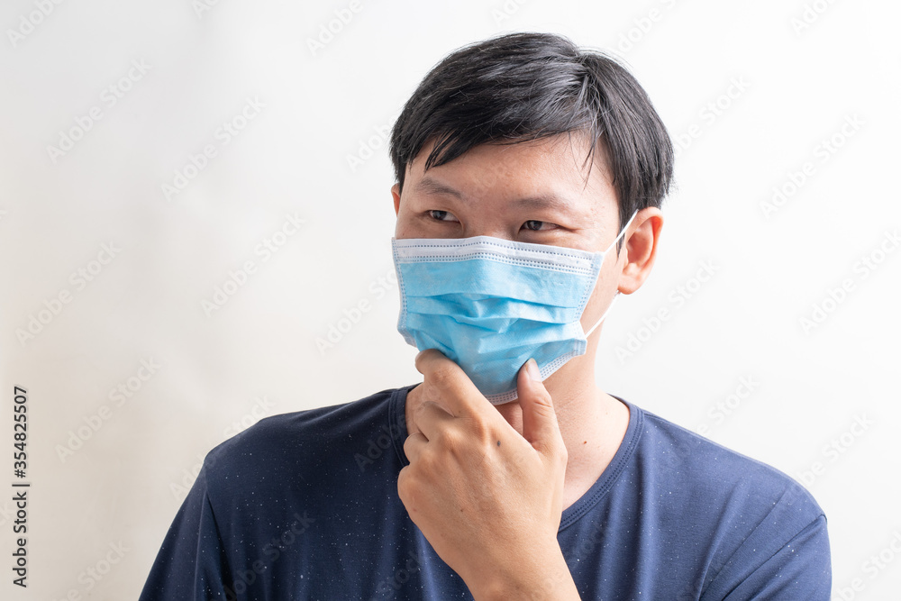 Man wearing facial hygienic mask. white background Virus protection against corona virus,covid19. City air pollution concept. Man wearing facial hygienic mask. white background Virus protection against corona virus,covid19. City air pollution concept.